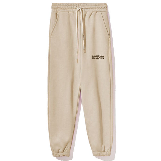 Pantaloni de trening bej din bumbac Comme Des Fuckdown pentru femei